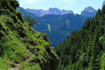 Scenic view green Alpine mountains with rugged ravines, mountain range in Europe, challenging...