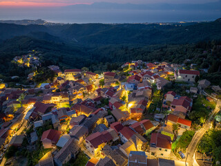 Aerial drone view of traditional Episkepsi village in north corfu,Greece by night, Summer time