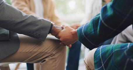 Holding hands, support and people praying or worship God together in a circle gathering for...