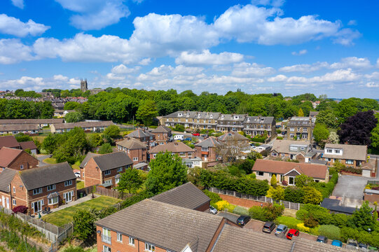Aerial photo of the village of Pudsey in Leeds West Yorkshire in the UK, showing a typical British streets and houses, church and roads taken with a drone on a sunny summers day