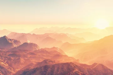 Foto op Plexiglas A breathtaking mountain landscape at sunrise. © Chaiwat