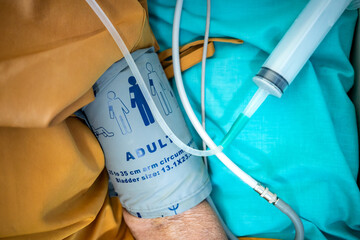Arm of a hospitalized patient using sphygmomanometer for measuring blood pressure