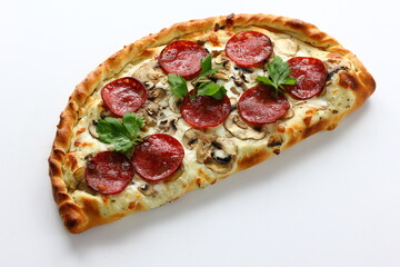 Petite pizza calzone on a white background