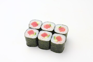 Sushi delivery. Set of rolls in a disposable box on a black background. Top view