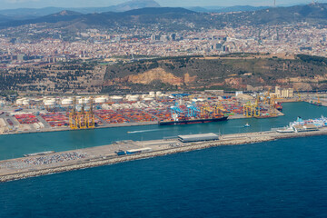 An aerial view of Barcelona's seaport, sea and cityscape.