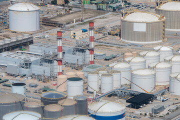 Top view of the oil refinery, oil processing and storage tanks, industrial area.