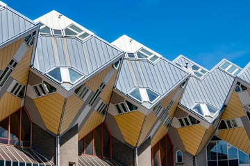 Fototapeten Cube houses or Kubuswoningen, modernist construction seen from lower angle, cube at 45° angle on hexagonal-shaped pillars, sunny day in city of Rotterdam, Zuid-Holland, Netherlands © Emile