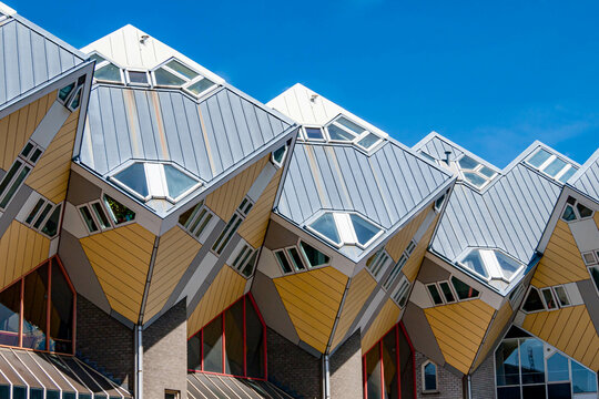 Cube houses or Kubuswoningen, modernist construction seen from lower angle, cube at 45° angle on hexagonal-shaped pillars, sunny day in city of Rotterdam, Zuid-Holland, Netherlands