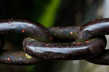 Close-up view of strong old chain links.