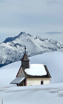 small church in the snow covered mountains