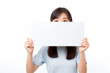 Teen pretty Japanese girl over isolated white background holding an empty placard