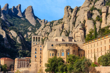 View of the famous Santa Maria de Montserrat Abbey located on the mountain of Montserrat nearby...