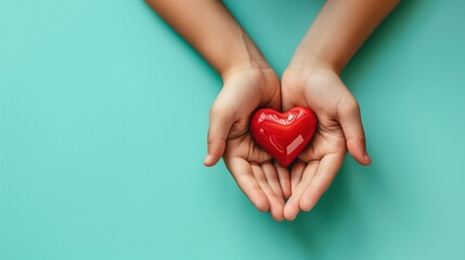 heart in hands, health , love and donating concept, isolated on light green background