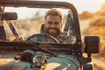 Smiling bearded man driving his off-road car in the mountains