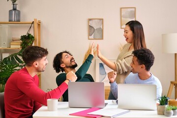 Group of diverse university colleagues celebrating good grades on the university test.