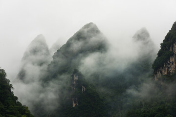 Karst peaks among clouds and mist