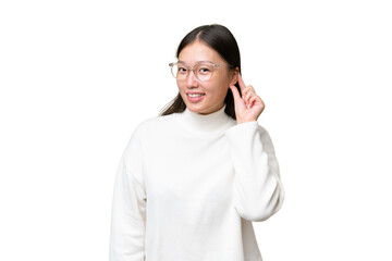 Young Asian woman over isolated background laughing