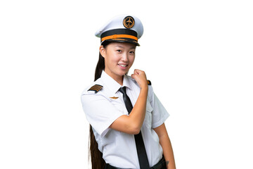 Airplane pilot Asian woman over isolated background celebrating a victory