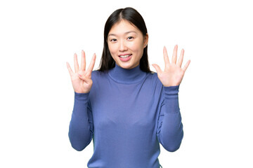 Young Asian woman over isolated chroma key background counting nine with fingers