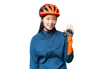 Young cyclist woman over isolated chroma key background saluting with hand with happy expression - obrazy, fototapety, plakaty