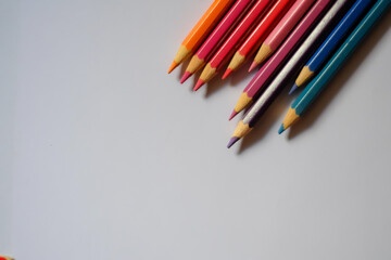 Beautiful colour pencils use as background with copy space. Color pencils isolated on white background close up with Clipping path.