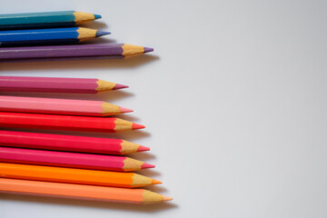 Fototapeta premium Beautiful colour pencils use as background with copy space. Color pencils isolated on white background close up with Clipping path.