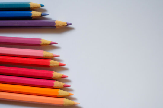 Beautiful colour pencils use as background with copy space. Color pencils isolated on white background close up with Clipping path.
