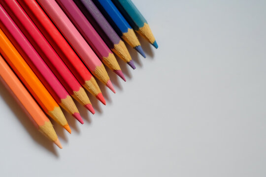 Beautiful colour pencils use as background with copy space. Color pencils isolated on white background close up with Clipping path.