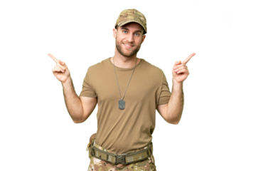 Military with dog tag over isolated chroma key background pointing finger to the laterals and happy
