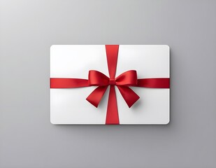 Blank white gift card with red ribbon bow isolated on background with shadow minimal conceptual