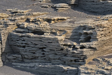 Russia. The Far East. The unique texture of the coastal rocks of Iturup Island, caused by the...