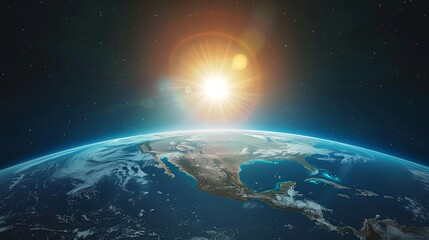 The sun is rising over the Earth, casting a warm glow over the planet. The North and South American continents are visible, as well as the Atlantic and Pacific Oceans.
