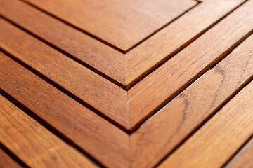 Edge and corner of wooden table. Closeup