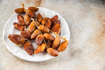 date on a branch dried sweet fruit fresh appetizer meal food snack on the table copy space food background rustic top view