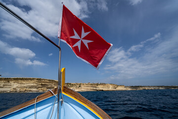 Malta flag in the wind. Sunny day - 784657932