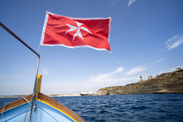 Malta flag in the wind. Sunny day - 784658162