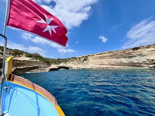 Malta flag in the wind. Sunny day - 784658573