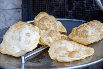 Freshly cooked halwa puri at a sweet shop in steel pot for sale - obrazy, fototapety, plakaty