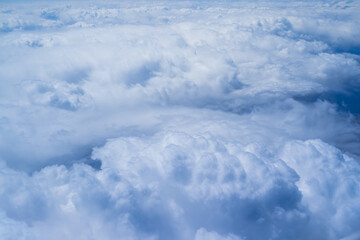 cloudscape shot from airplane, over the cloud, daytime