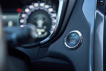 Car dashboard with start engine button on panel. Modern vehicle interior
