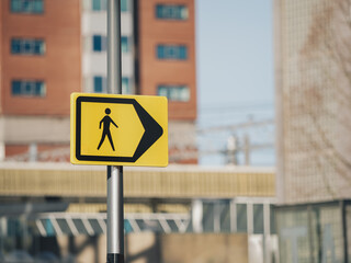 Pedestrian Directional Arrow Sign in Urban Area