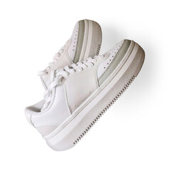 White tennis-type sports shoes, fashionable footwear among young people with transparent background and shadow