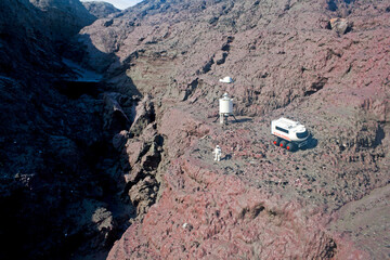 Martian base diorama whith astronauts exploring Mars on a natural landscape