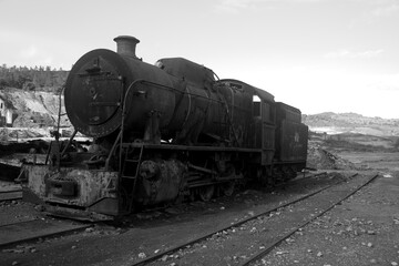 Fototapeta na wymiar abandoned rusty locomotive on a track