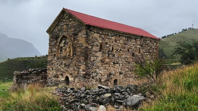 Thaba-Yerdy in Ingushetia. ZEISS, RUSSIA - MAY 19, 2023: Video of the Thaba-Yerdy Temple, the oldest temple in Ingushetia. The Caucasus Mountains. 4K