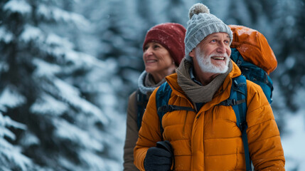 A smiling elderly caucasian couple hiking in snow-covered mountains, surrounded by serene evergreen trees