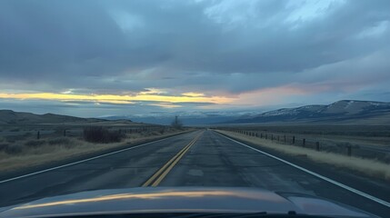 Empty road with mountain views seen through the front windshield of a car. generative ai