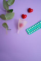 Menstrual cup over violet background, eco friendly and zero waste solution