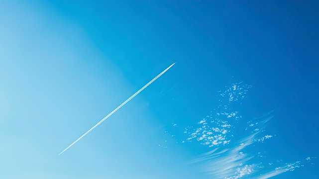 airplane tracks in the air, blue sky background, plane tracks in the sky