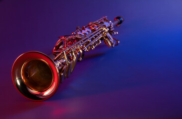 Soprano Saxophone with Colorful Red and Blue Jazzy Lighting and Negative Space